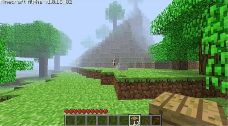 Paysage de Minecraft en version Alpha, avec ses arbres, son herbe et un établi
